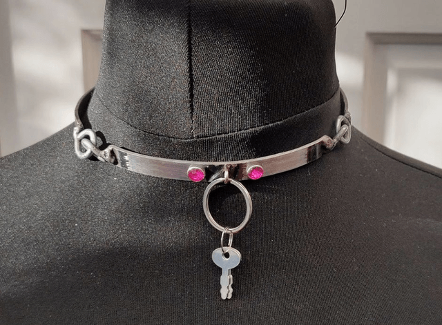 Simple steel collar with pink adornments